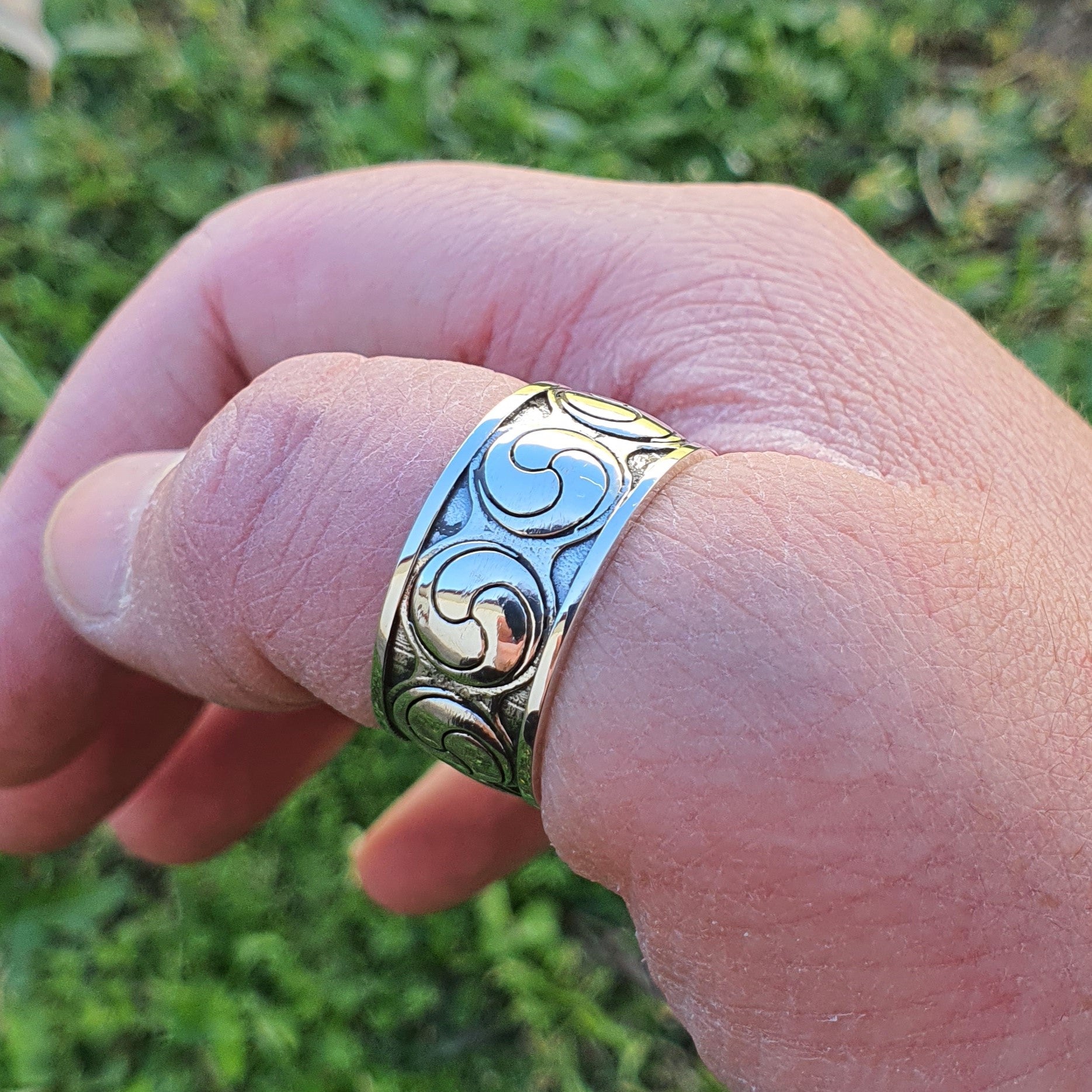 Sterling silver manufactured using wax casting, polished for a slightly textured, mild sheen surface, and recessed details blackened for a steampunk look.