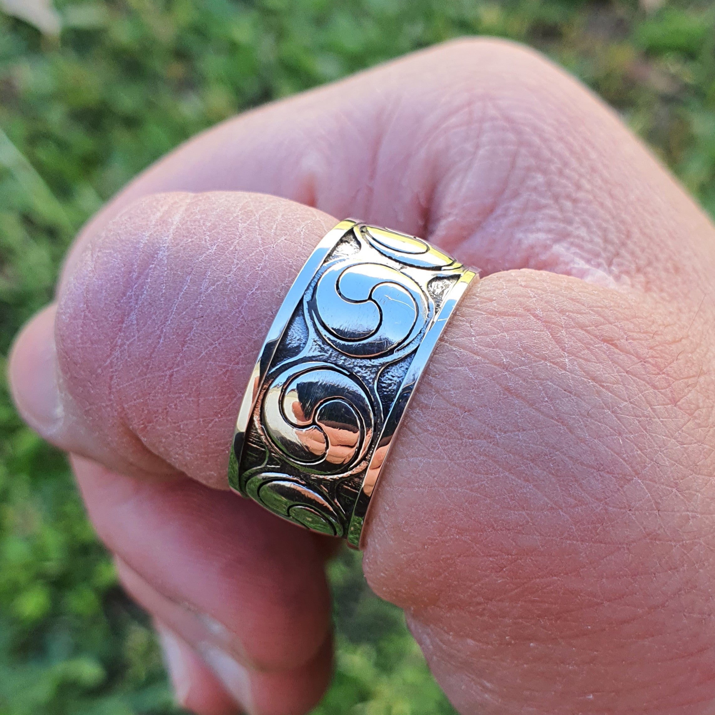 Sterling silver manufactured using wax casting, polished for a slightly textured, mild sheen surface, and recessed details blackened for a steampunk look.