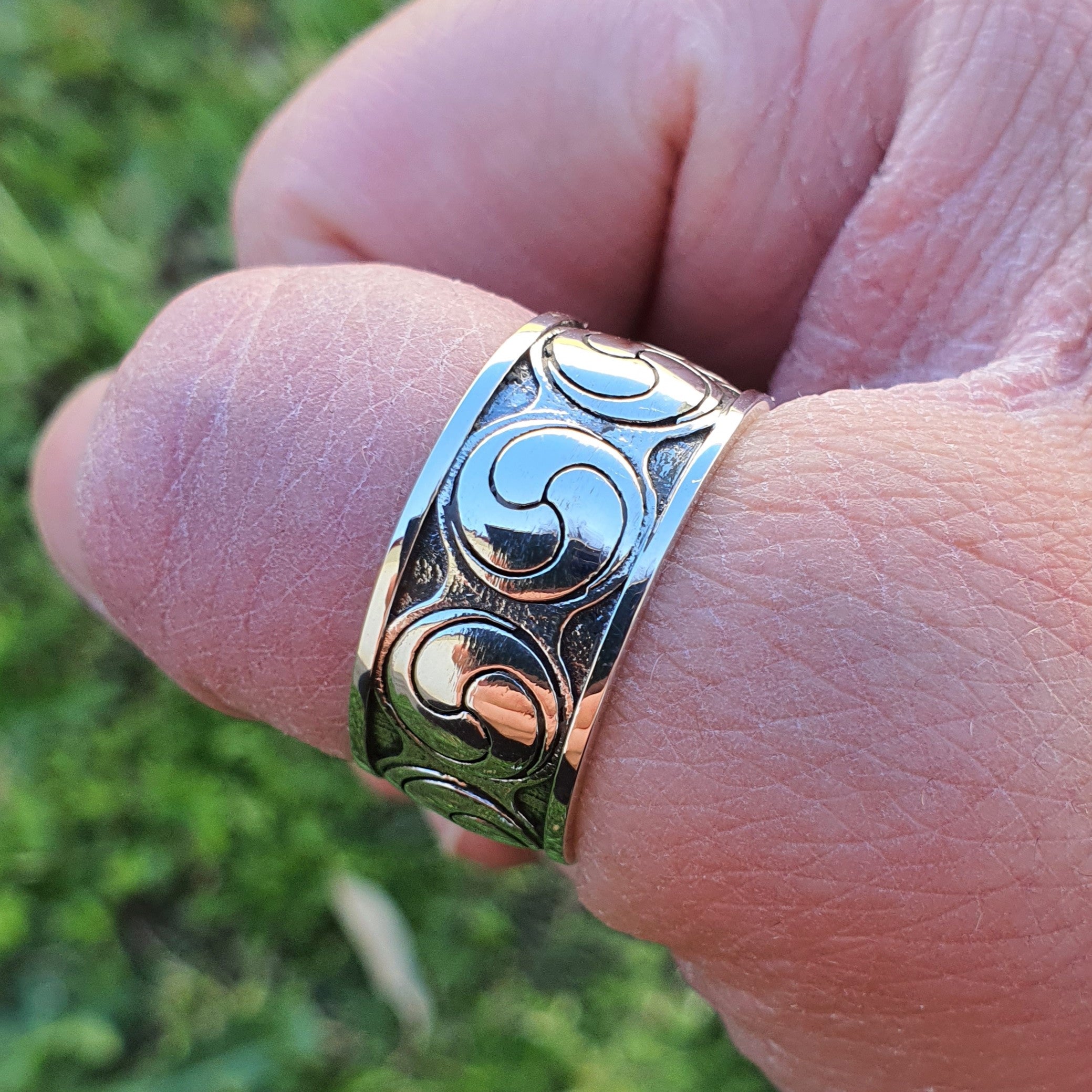 Sterling silver manufactured using wax casting, polished for a slightly textured, mild sheen surface, and recessed details blackened for a steampunk look.