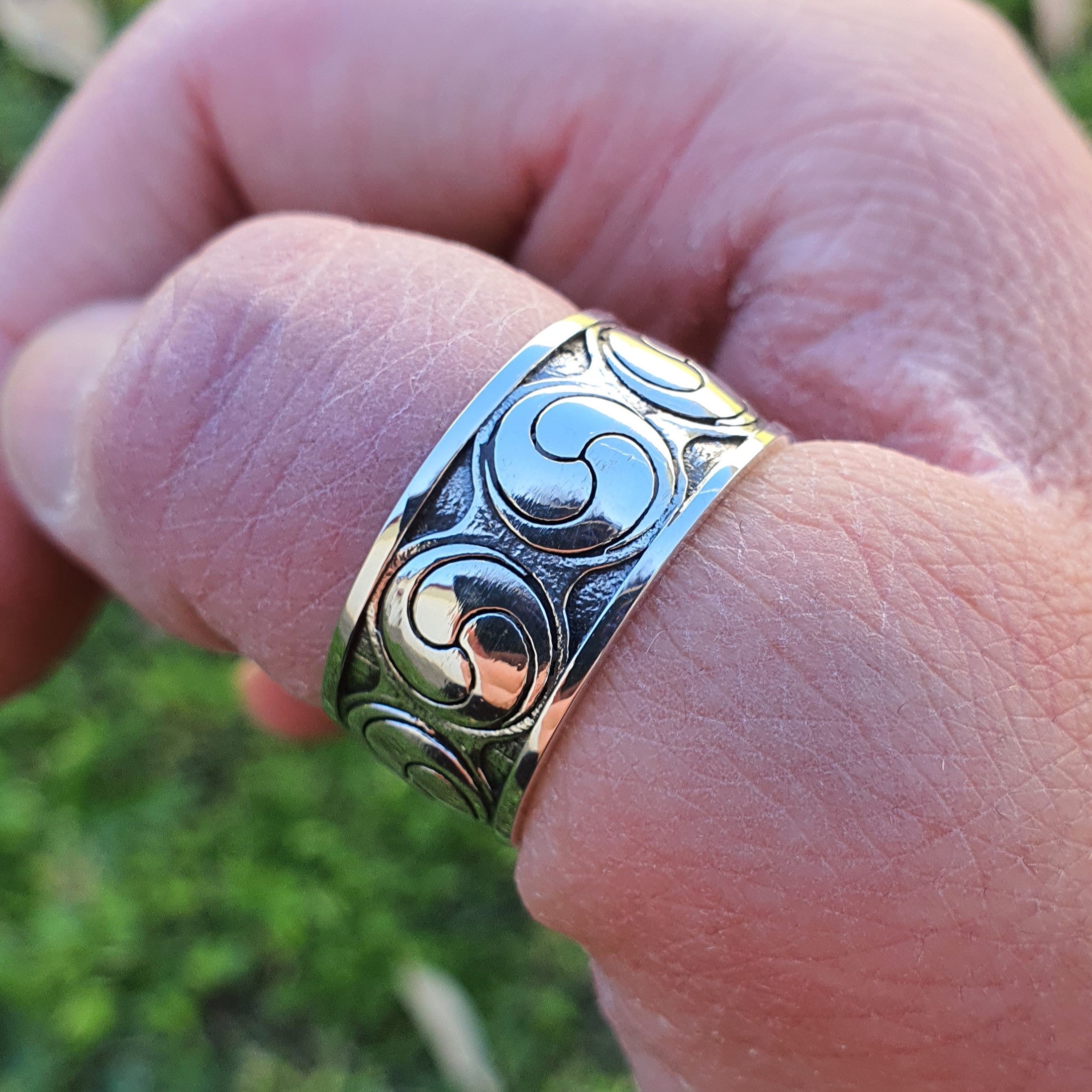 Sterling silver manufactured using wax casting, polished for a slightly textured, mild sheen surface, and recessed details blackened for a steampunk look.
