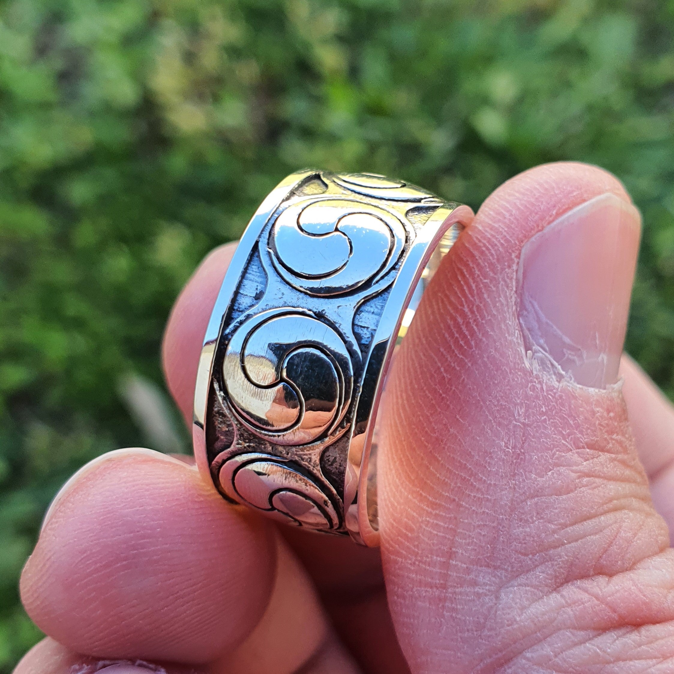 Sterling silver manufactured using wax casting, polished for a slightly textured, mild sheen surface, and recessed details blackened for a steampunk look.
