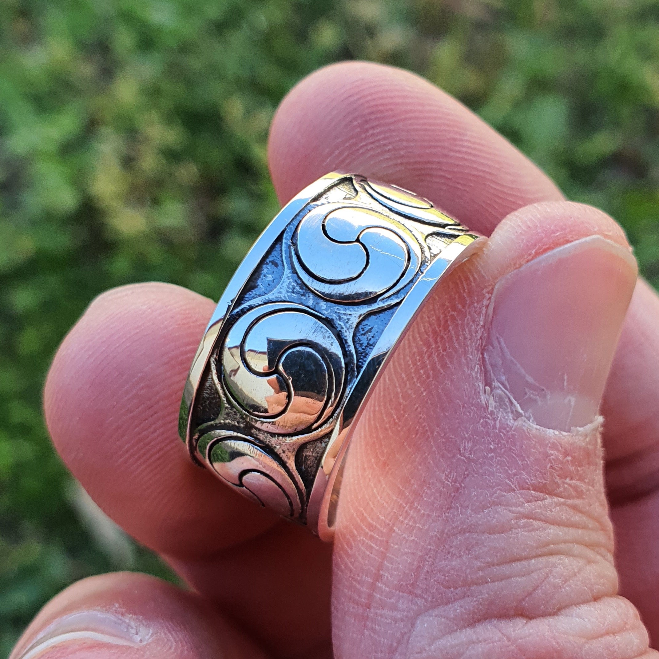 Sterling silver manufactured using wax casting, polished for a slightly textured, mild sheen surface, and recessed details blackened for a steampunk look.